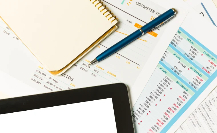 an overview of business reports and notes on a desk in a modern office environment photo 1