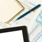 an overview of business reports and notes on a desk in a modern office environment photo 1